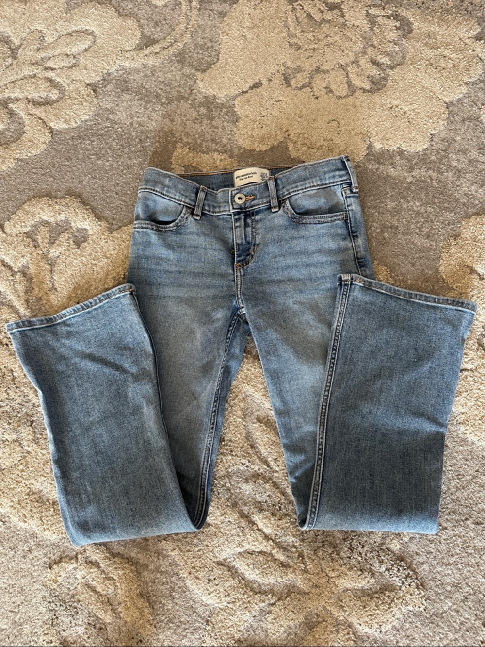 Abercrombie Kids, Girls 11-12 Regular length low rise boot cut jeans. Light Blue